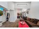 Bright living room with a large sofa, open to the kitchen and dining area, and filled with natural light at 3551 N 12Th St # 101, Phoenix, AZ 85014