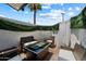 Stylish outdoor patio with wicker furniture, fire pit table, and greenery providing privacy and a cozy atmosphere at 3551 N 12Th St # 101, Phoenix, AZ 85014