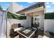 Cozy outdoor patio space includes patio furniture, privacy features, and sliding glass doors to the home's interior at 3551 N 12Th St # 101, Phoenix, AZ 85014