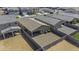 Aerial view of the backyard, fenced and gravel-covered with covered patio at 36602 W San Alvarez Ave, Maricopa, AZ 85138