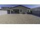 Gravel backyard with a covered patio at 36602 W San Alvarez Ave, Maricopa, AZ 85138