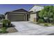 Charming single-story home with a spacious driveway and well-manicured landscaping enhancing its curb appeal at 36602 W San Alvarez Ave, Maricopa, AZ 85138