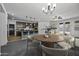 Open-concept living space with a modern kitchen, dining area, and cozy living room, ideal for Gathering gatherings at 36602 W San Alvarez Ave, Maricopa, AZ 85138