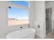Relaxing bathroom with a freestanding tub and a glass-enclosed shower at 37504 W Elm Ave, Tonopah, AZ 85354