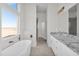 Modern bathroom with a soaking tub and double vanity with granite counters at 37504 W Elm Ave, Tonopah, AZ 85354