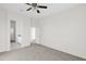 Empty bedroom with neutral carpet and access to a bathroom at 37504 W Elm Ave, Tonopah, AZ 85354