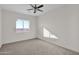 Cozy bedroom with carpet, ceiling fan, and lots of natural light at 37504 W Elm Ave, Tonopah, AZ 85354