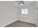 Bedroom with neutral walls, carpet, and a bright window at 37504 W Elm Ave, Tonopah, AZ 85354