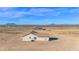 Wide shot of desert home featuring neutral stucco, and drought-resistant landscaping at 37504 W Elm Ave, Tonopah, AZ 85354