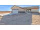 The front exterior features stone accents and a concrete driveway and walkway at 37504 W Elm Ave, Tonopah, AZ 85354