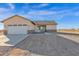 Charming single-story home with a two-car garage and desert landscaping at 37504 W Elm Ave, Tonopah, AZ 85354