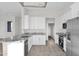 The kitchen boasts granite countertops, stainless steel appliances, and ample cabinet space at 37504 W Elm Ave, Tonopah, AZ 85354
