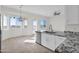 Bright kitchen with a view, granite counters, and stainless steel appliances at 37504 W Elm Ave, Tonopah, AZ 85354