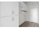 The laundry room has lots of cabinets and an exterior door at 37504 W Elm Ave, Tonopah, AZ 85354