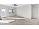 Spacious living room with wood tile floors and natural light at 37504 W Elm Ave, Tonopah, AZ 85354