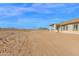 Spacious backyard with a covered patio, perfect for outdoor entertaining and relaxation at 37504 W Elm Ave, Tonopah, AZ 85354