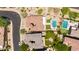 Overhead shot of a home with tile roof, pool, putting green, and neat landscaping at 3804 E Daley Ln, Phoenix, AZ 85050