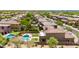 Stunning aerial view showcasing houses, swimming pools, and lush green yards at 3804 E Daley Ln, Phoenix, AZ 85050