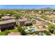 Scenic aerial view showcasing a swimming pool and manicured yard near residential homes at 3804 E Daley Ln, Phoenix, AZ 85050