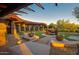 Custom backyard boasts modern architecture, a tranquil water feature, and lush landscaping for outdoor enjoyment at 3804 E Daley Ln, Phoenix, AZ 85050
