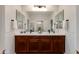 The bathroom offers a large mirror, double sinks, and white towels, offering an excellent space at 3804 E Daley Ln, Phoenix, AZ 85050