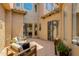 Private courtyard with stylish outdoor furniture, lush greenery, and string lights create a relaxing atmosphere at 3804 E Daley Ln, Phoenix, AZ 85050