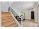 Elegant entryway showcasing staircase, dining room, and dark wood front door at 3804 E Daley Ln, Phoenix, AZ 85050