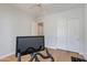 Bright exercise room featuring modern stationary bike, fan, and closet with sliding doors at 3804 E Daley Ln, Phoenix, AZ 85050