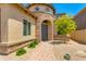 Welcoming front entry featuring a stone walkway, desert landscaping, and a charming entrance at 3804 E Daley Ln, Phoenix, AZ 85050