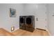 Clean and organized laundry area featuring modern washer and dryer units, with wooden countertop at 3804 E Daley Ln, Phoenix, AZ 85050