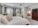 Inviting main bedroom with plush bedding, ensuite, and abundant natural light at 3804 E Daley Ln, Phoenix, AZ 85050