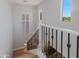 Modern staircase with decorative iron railings and abundant natural light at 3804 E Daley Ln, Phoenix, AZ 85050