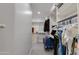 Spacious walk-in closet features custom shelving units and provides ample storage space at 3804 E Daley Ln, Phoenix, AZ 85050