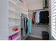 This walk-in closet has custom shelving providing ample storage for clothes, shoes, and accessories at 3804 E Daley Ln, Phoenix, AZ 85050
