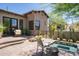Backyard patio with a spa, outdoor seating, and landscaping at 41916 N 101St N Pl, Scottsdale, AZ 85262