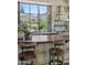 Bright kitchen featuring a farmhouse sink with large picturesque window showcasing stunning desert views at 41916 N 101St N Pl, Scottsdale, AZ 85262