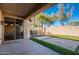 Covered back patio that offers seamless indoor-outdoor living and serene views of the desert landscaped yard at 42360 W Abbey Rd, Maricopa, AZ 85138