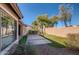 Desert landscaped backyard featuring artificial turf and a stone patio for outdoor enjoyment at 42360 W Abbey Rd, Maricopa, AZ 85138