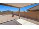 An open patio in the backyard features gravel landscaping and a small fire pit at 43938 W Colby Dr, Maricopa, AZ 85138
