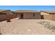 A low-maintenance backyard with stone features complemented by a covered patio for outdoor enjoyment at 43938 W Colby Dr, Maricopa, AZ 85138