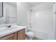 A clean bathroom includes a tub and shower combination, a sink, and a commode at 43938 W Colby Dr, Maricopa, AZ 85138