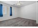 Clean and bright bedroom featuring neutral walls, carpet, and a window for ample natural light at 43938 W Colby Dr, Maricopa, AZ 85138