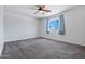 Serene bedroom with carpet, ample natural light, perfect for relaxation and rejuvenation at 43938 W Colby Dr, Maricopa, AZ 85138