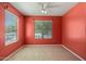 Cozy room with two windows and neutral-toned walls and flooring perfect for relaxing or entertaining at 43938 W Colby Dr, Maricopa, AZ 85138