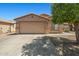 Charming single-story home featuring a spacious two-car garage and a well-maintained front yard at 43938 W Colby Dr, Maricopa, AZ 85138