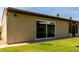 Backyard of the house with a lawn and sliding glass door at 4502 E Carol Ave # 4, Mesa, AZ 85206