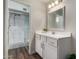 Bathroom features a shower with glass door, nice vanity, and modern fixtures at 4502 E Carol Ave # 4, Mesa, AZ 85206
