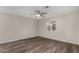 Spacious bedroom features wood floors, ceiling fan and a window providing natural light at 4502 E Carol Ave # 4, Mesa, AZ 85206