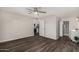 Spacious bedroom with a ceiling fan and views into the bathroom and kitchen at 4502 E Carol Ave # 4, Mesa, AZ 85206