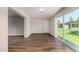 Bright living room with vinyl floors and natural light from a sliding glass door at 4502 E Carol Ave # 4, Mesa, AZ 85206